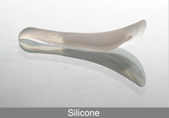 Silicone implant commonly used in rhinoplasty for nasal bridge augmentation, shown as a pre-shaped alloplastic nose implant.
