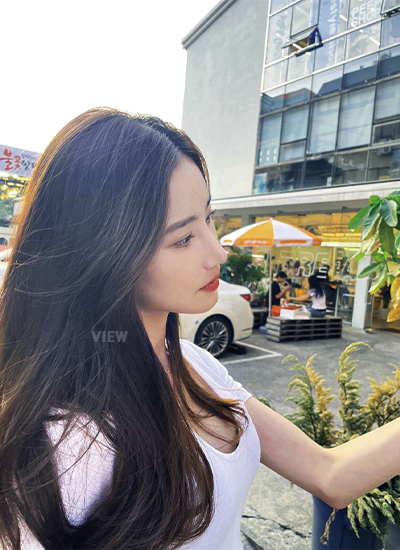 Woman three week after receiving rhinoplasty at a Korean plastic surgery clinic